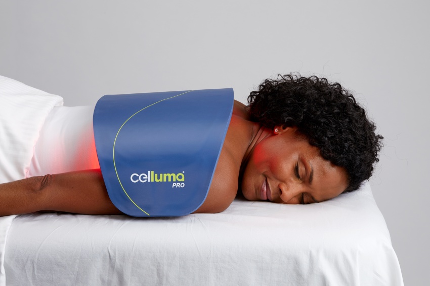 Woman laying under a Celluma device