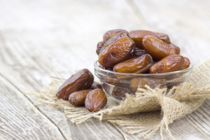 Dates in a small glass bowl